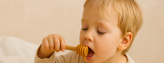 Manuka Honey for kids - a Kid with a spoon of honey